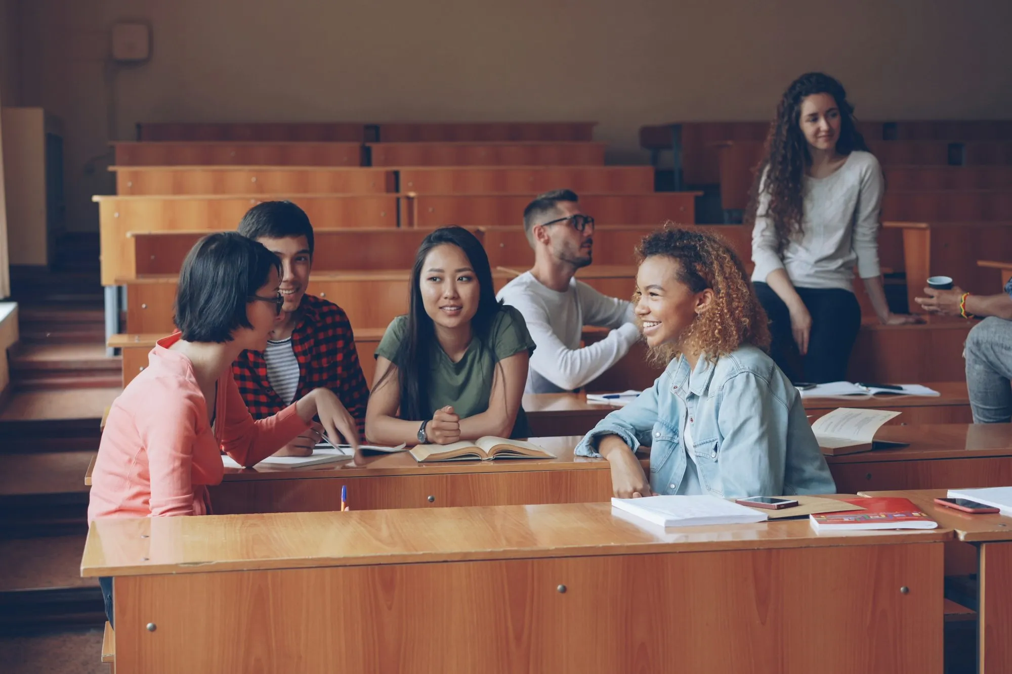 Students talking in a university lecture hall